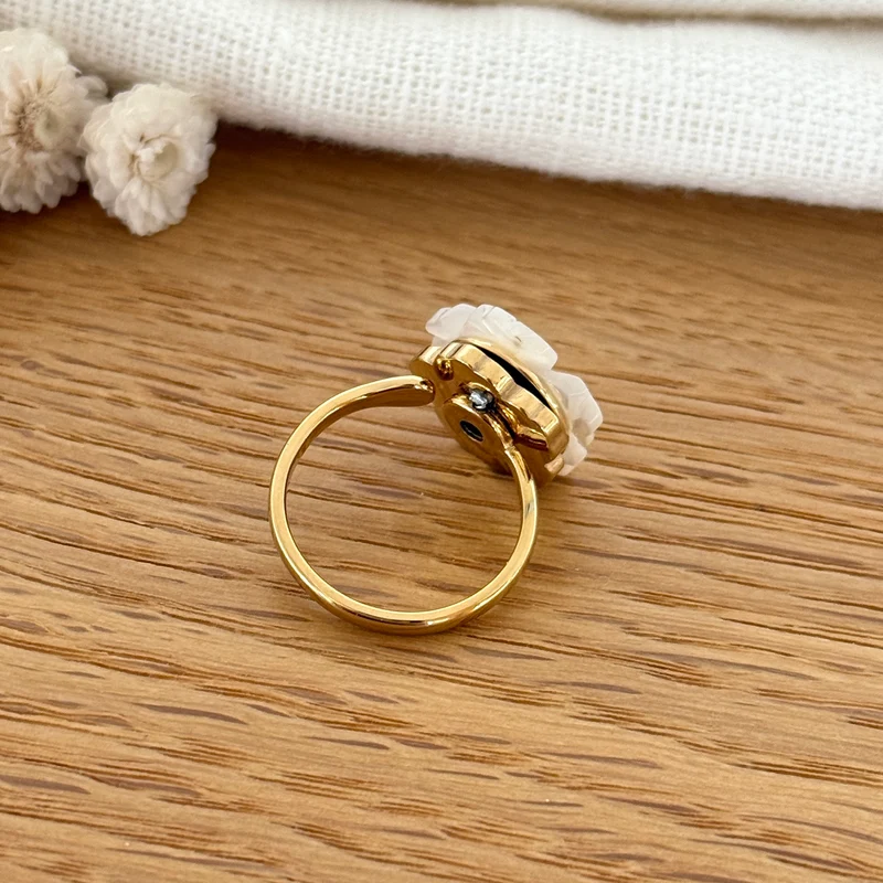 Bague tournante "Fleur nacre" acier