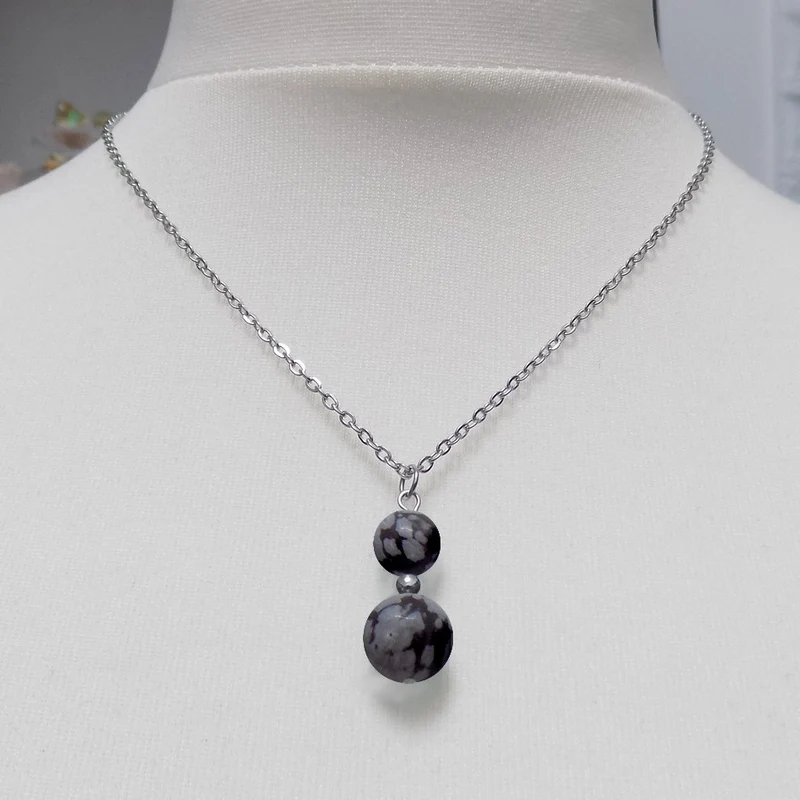 Collier à pendentif deux perles en pierre d'obsidienne flocon de neige