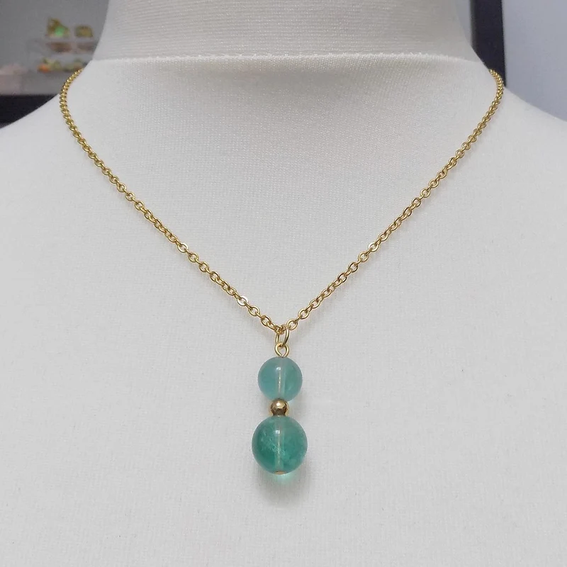 Collier à pendentif deux perles en pierre de fluorite bleue