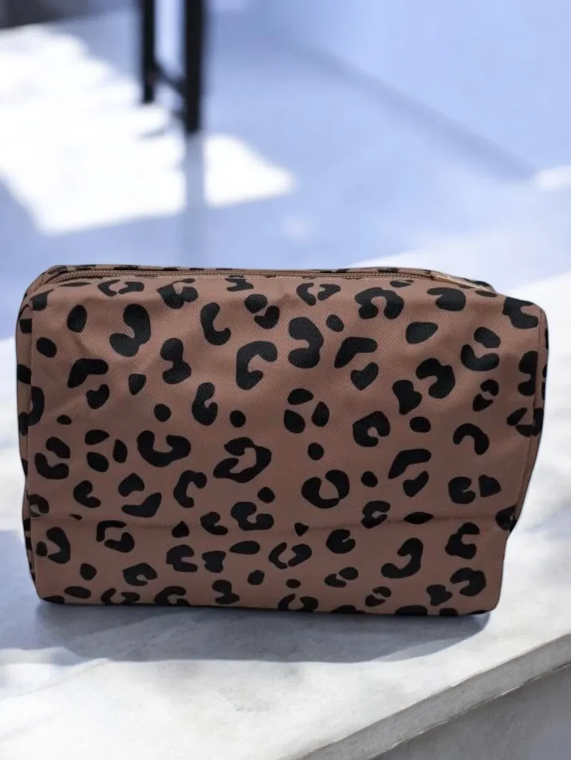 Pochette imperméable léopard à fermeture dorée