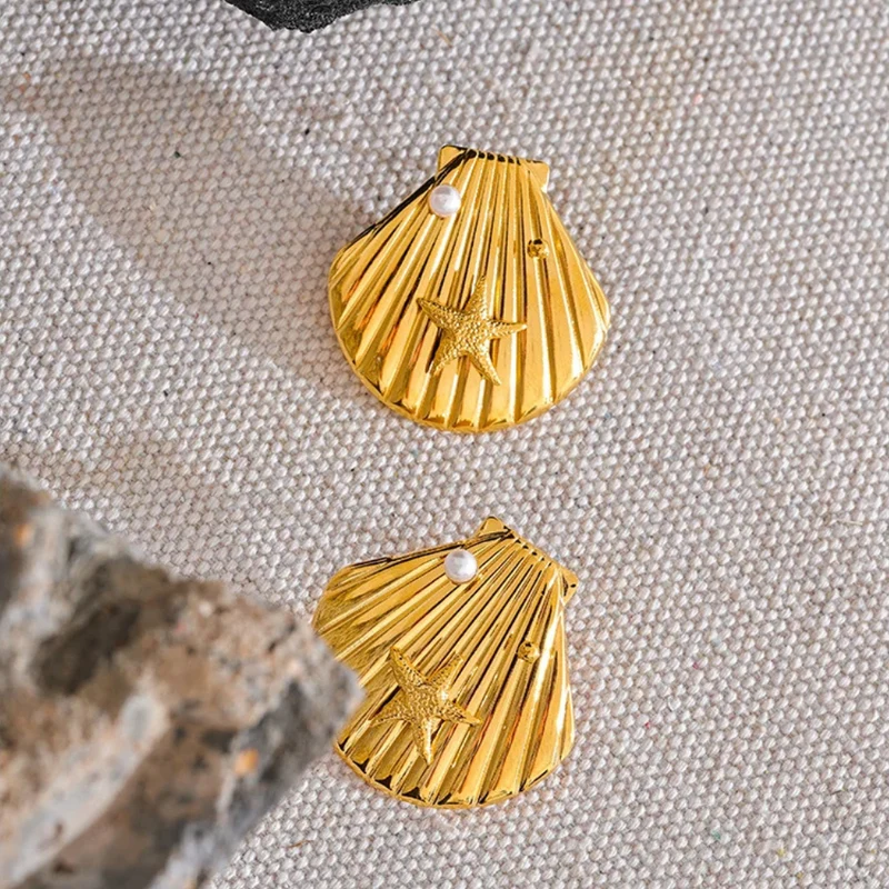 Puces d'Oreilles Coquillage
